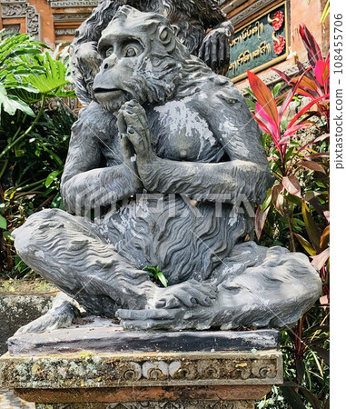 Stone monkeys statues in sacred monkey forest. Old decorative monkey sculptures in Bali ubud sacred forest Stone monkeys statues in sacred monkey forest. Old decorative monkey sculptures in Bali ubud sacred forest 108455706