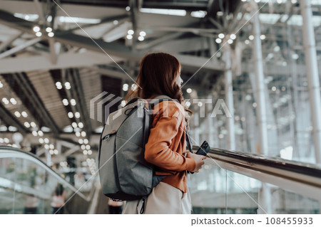 Young asian woman in international airport terminal or modern train station 108455933