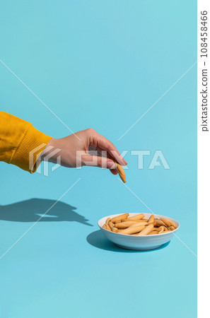 Womans hand take mini picos 108458466