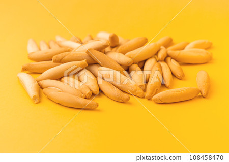 Heap of Spanish mini picos on yellow 108458470