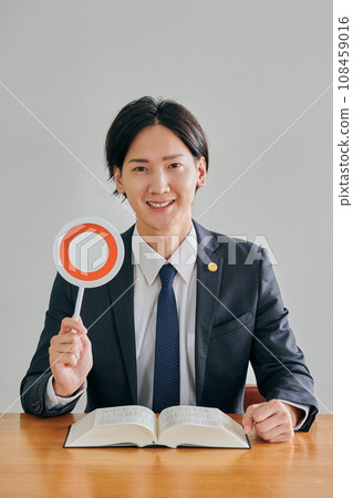 A male lawyer making a judgment A male lawyer making a judgment 108459016