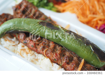 Kebab, traditional turkish meat food with salad on a plate . Kebab, traditional turkish meat food with salad on a plate . 108460361