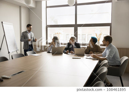 Diverse creative team meeting in training room, listening to speaker 108461895