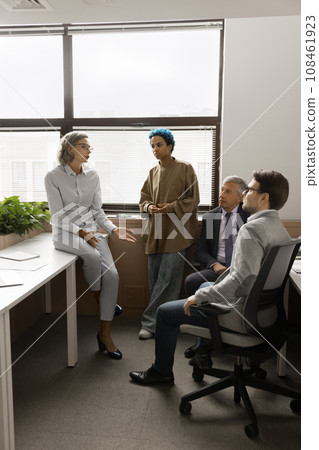 Mature project manager and diverse team meeting in office space 108461923