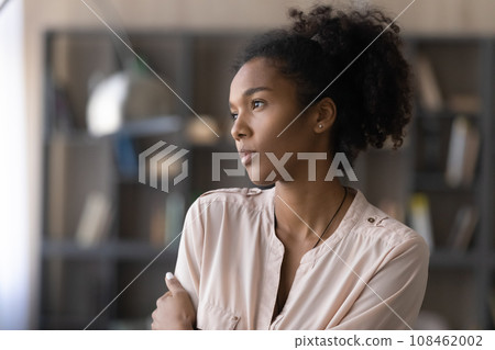 Thoughtful millennial African American girl woman looking at window away 108462002