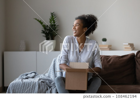 Happy young African woman, millennial shopper, online store customer Happy young African woman, millennial shopper, online store customer 108462194