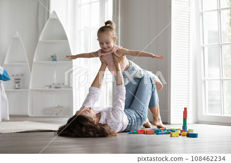 Happy young mother play with little daughter Happy young mother play with little daughter 108462234