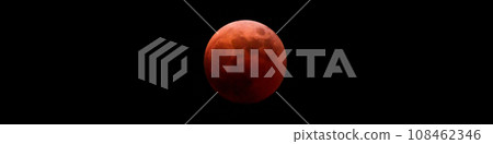 The red moon completely in the shadow of the earth in a total lunar eclipse [ image of a lunar eclipse ] 108462346