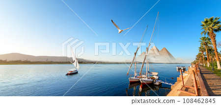 Sailboat in Aswan and pyramids 108462845