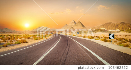 Panorama of road and pyramids 108462852