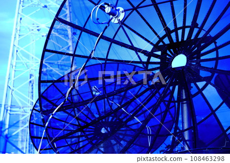 Parabolic antenna, blue sky and power line tower - image material for electronic communication and electricity 108463298