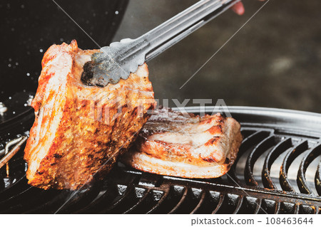 barbecue camping with grill crispy pork at night 108463644