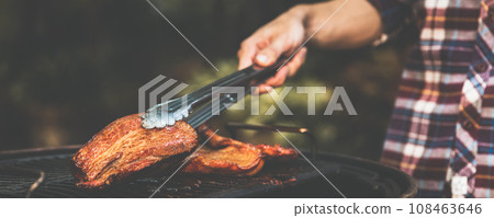 barbecue camping with grill crispy pork at night 108463646