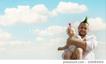 Happy father and his little baby son with funny hairs on sky background - 108464930