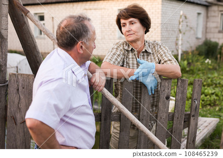 Elderly man meets a housemate in the village 108465239