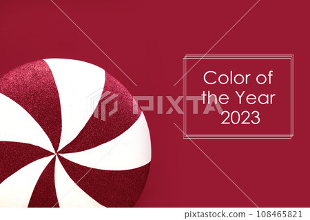 Magenta-white lollipop swirl on a white stick over Magenta Color of the Year 2023 background. copy space. Sweetness. Color of the Year on a background of Viva Magenta colors. Creative design Magenta-white lollipop swirl on a white stick over Magenta Color of the Year 2023 background. copy space. Sweetness. Color of the Year on a background of Viva Magenta colors. Creative design 108465821