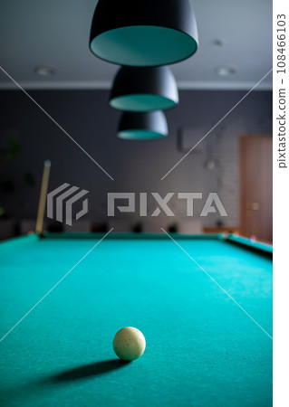 Playing billiard. Billiard white ball on green billiards table. Billiard sport concept. Pool billiard game. 108466103