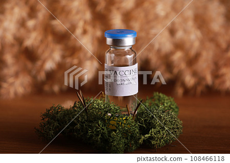 vaccine selection. Ampoules with Covid-19 vaccine in laboratory. to fight the coronavirus sars-cov-2 pandemic. Glass vial medical close-up isolated on nature background. vaccine selection. Ampoules with Covid-19 vaccine in laboratory. to fight the coronavirus sars-cov-2 pandemic. Glass vial medical close-up isolated on nature background. 108466118