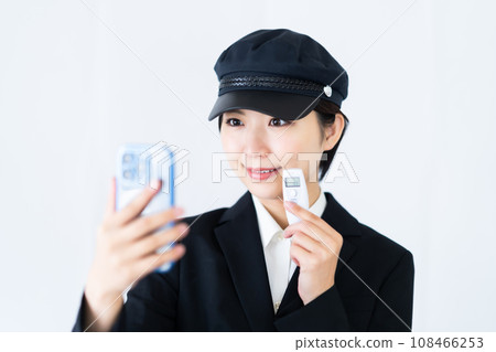 Young female driver recording alcohol test results, white background 108466253