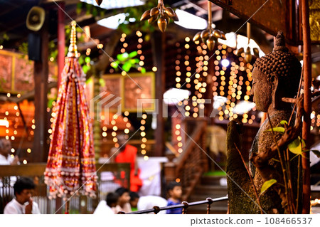 Buddha statue and people praying at a temple in Colombo, the capital of Sri Lanka 108466537