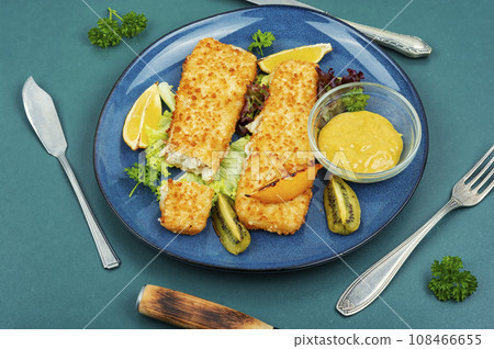 Fried pollock fillets with breadcrumbs 108466655