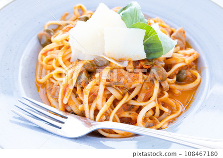 Delicious Italian pasta with tomato sauce Delicious Italian pasta with tomato sauce 108467180