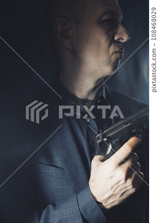 Mercenary hitman spy assasin with gun 108468029