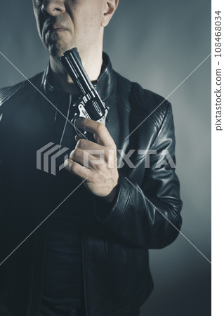 Black leather jacket hitman spy with gun Black leather jacket hitman spy with gun 108468034