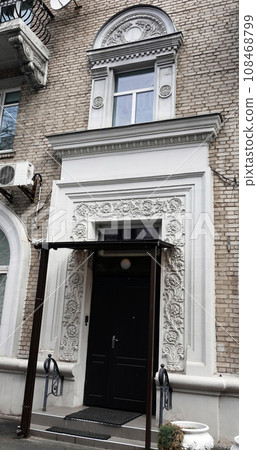 Kiev, Ukraine April 13, 2021: Ornate facade of an ancient building in the center of Kiev Kiev, Ukraine April 13, 2021: Ornate facade of an ancient building in the center of Kiev 108468799