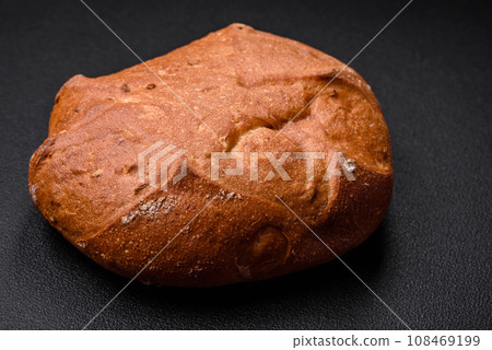 Delicious fresh crispy brown bread with seeds and grains 108469199