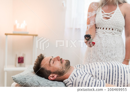 Woman healer doing aromatherapy by smoldering sage, an alternative medicine Woman healer doing aromatherapy by smoldering sage, an alternative medicine 108469955