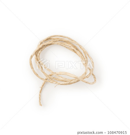 Twisted natural thin rope on white background Twisted natural thin rope on white background 108470915