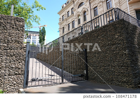 Kiev, Ukraine June 10, 2021: the old forged gate, which closes the passage to the courtyard of the house 108471178