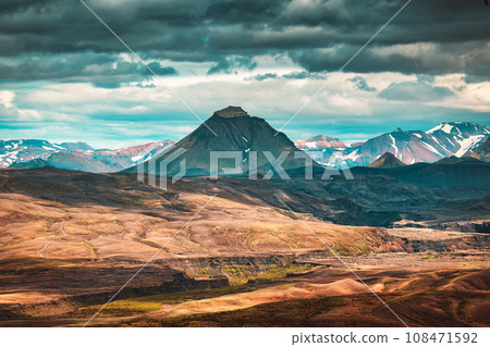 Volcano mountain on lava field and cloudy sky in Icelandic Highlands 108471592