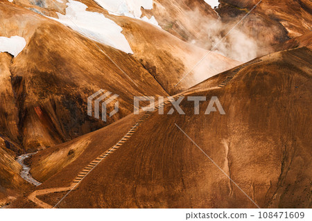 Kerlingarfjoll volcanic mountain range on geothermal area and sulphur smoke in summer at Highlands of Iceland 108471609