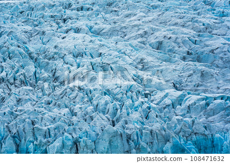 Rugged textured natural blue iceberg in Fjallsarlon iceberg lagoon Rugged textured natural blue iceberg in Fjallsarlon iceberg lagoon 108471632