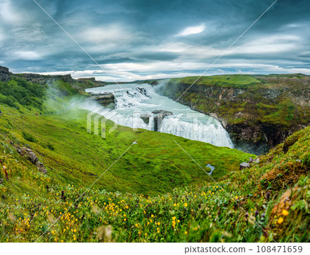 Gullfoss powerful waterfall flowing from Hvita river and moody sky in summer at Iceland Gullfoss powerful waterfall flowing from Hvita river and moody sky in summer at Iceland 108471659