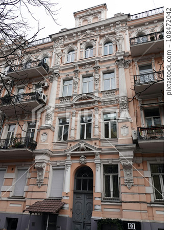 Kiev, Ukraine November 28, 2020: Facade of a building artistically decorated with columns in the center of Kiev Kiev, Ukraine November 28, 2020: Facade of a building artistically decorated with columns in the center of Kiev 108472042