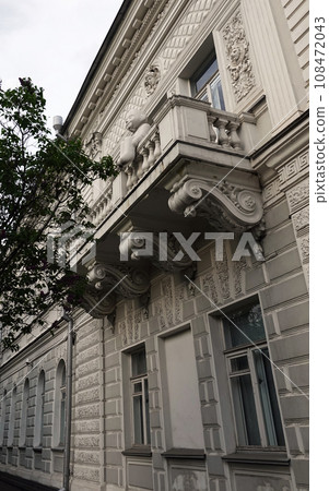 Kiev, Ukraine May 16, 2021: Facade of an old building with a balcony in the center of Kiev 108472043