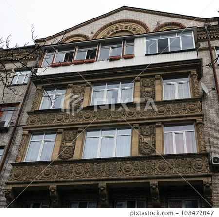 Kiev, Ukraine November 28, 2020: Facade of an old building with a balcony in the center of Kiev Kiev, Ukraine November 28, 2020: Facade of an old building with a balcony in the center of Kiev 108472047