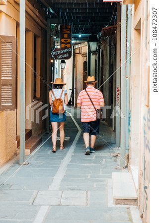 Tourists in the narrow streets of the old town of Rethymno. Tourists in the narrow streets of the old town of Rethymno. 108472307