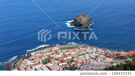Canary Islands, Spain March 18, 2013: Sea with an island and a coast built up with houses 108472541
