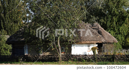 Kiev, Ukraine September 26, 2021: An old Ukrainian house in the National Museum of Folk Architecture and Life of Ukraine "Pirogovo" in Kiev Kiev, Ukraine September 26, 2021: An old Ukrainian house in the National Museum of Folk Architecture and Life of Ukraine "Pirogovo" in Kiev 108472604