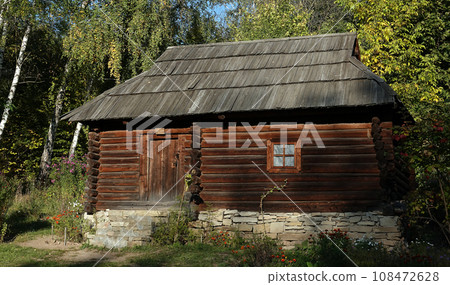 Kiev, Ukraine September 26, 2021: An old Ukrainian house in the National Museum of Folk Architecture and Life of Ukraine "Pirogovo" in Kiev Kiev, Ukraine September 26, 2021: An old Ukrainian house in the National Museum of Folk Architecture and Life of Ukraine "Pirogovo" in Kiev 108472628
