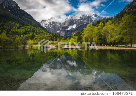 Amazing mountain lake and snowy peaks in Slovenia Amazing mountain lake and snowy peaks in Slovenia 108473571