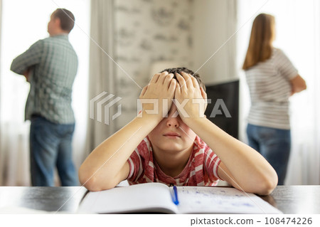 A quarrel between parents in presence of upset child 108474226