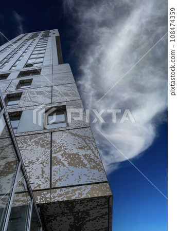 Fragment of a Modern Office building against a spectacular autumn sky Fragment of a Modern Office building against a spectacular autumn sky 108474359