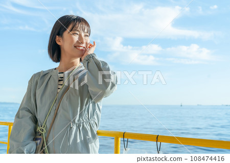 A woman on a boat A woman on a pleasure boat A woman on a boat A woman on a pleasure boat 108474416