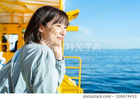 A woman on a boat A woman on a pleasure boat A woman on a boat A woman on a pleasure boat 108474418