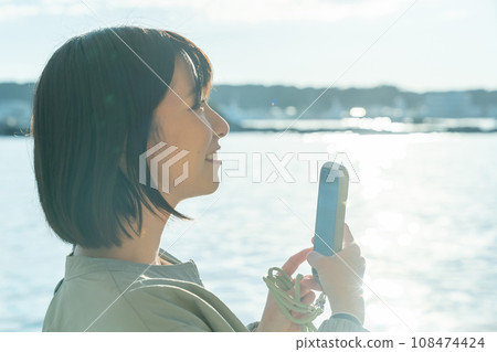 A woman on a boat A woman on a pleasure boat A woman on a boat A woman on a pleasure boat 108474424